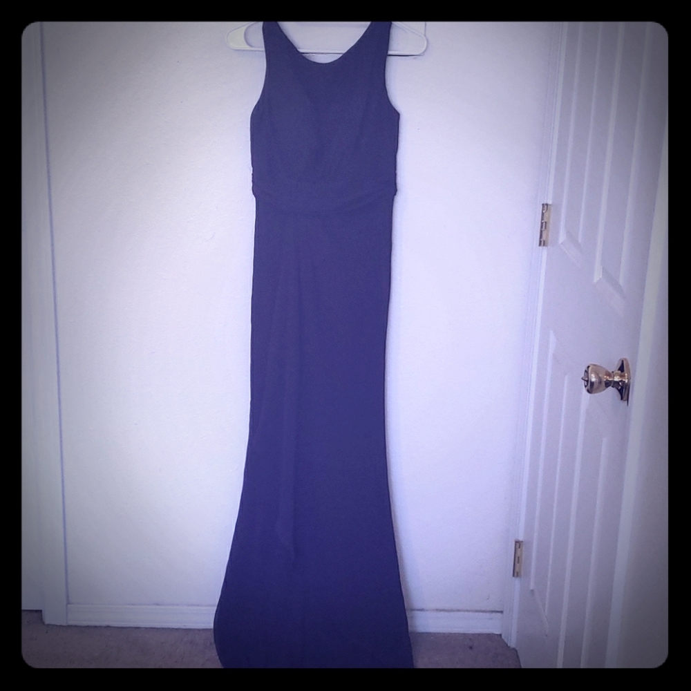 Floor length purple bridesmaids dress.